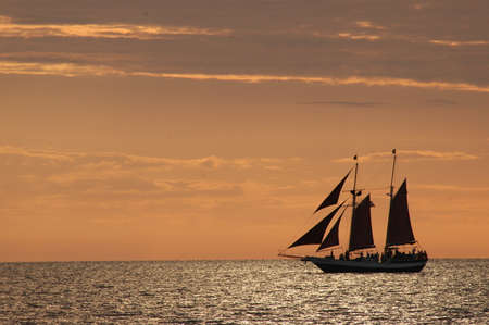 Tall ship sailing at sunsetのeditorial素材