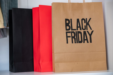 black friday shopping bag isolated with black and red colors  and with mock up space for writingの写真素材
