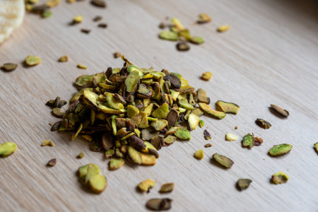Pistachio heap on wooden tableの写真素材