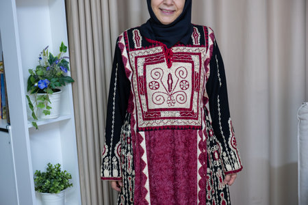 Female wearing palestinian traditional clothes indoorの写真素材