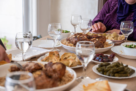Family eating together with multi generation members in modern living roomの写真素材