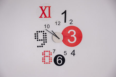 Modern wall clock with multicolor and designの写真素材
