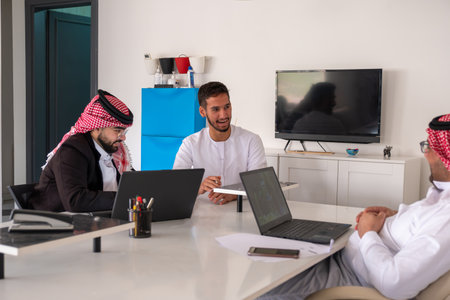 Arab males in meeting during work with copy spaceの写真素材