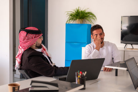 Arab males in meeting during work with copy space