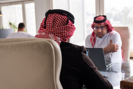 meeting between two arabs talking about work detailsの写真素材