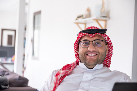 portrait for arabic male in home with cheerful facial expressionの写真素材