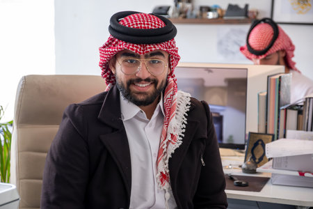 portrait for arabic male during work in office with smile on his face