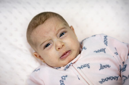 When your little one is experiencing cold symptoms like abdomen pain and crying, it's important to provide comfort and care. From soothing stomach flu to easing cold-related aches, love and supportの写真素材