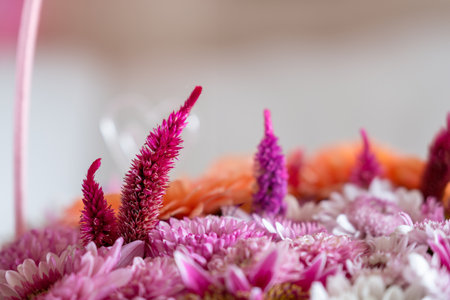 Pink Bouquet with heart shape and multi colors and balloons in the background as decoration for celebration withの写真素材