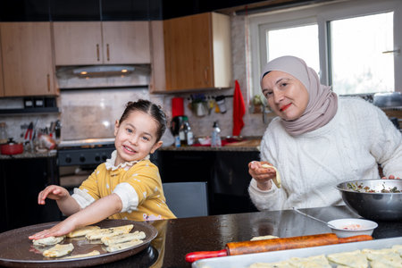 Cheerful Kid and Mother in Kitchen: Bonding Through Cooking, Joyful Learning, and Horizontal Exploration of Culinary Skillsの写真素材