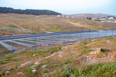 PV panels are used to generate electricity outdoors on green land with street beside