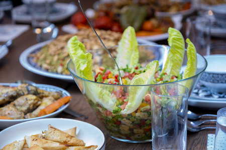 From above photo of colorful salad dish on family table ready for dinnerの写真素材