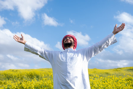 Arabic male enjoy spring time outdoors having clear mind and rest in nature to be positive and ready for the life issues to get rest fr fresh start,  to be Strives to be effective and productiveの写真素材
