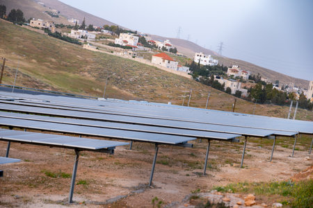 on ground pV modules are built and protected by fences from animals and peopleの写真素材