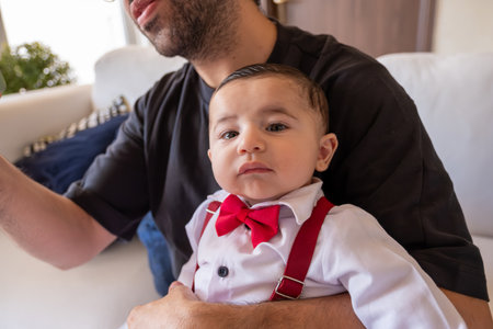 young father holding his babyの写真素材