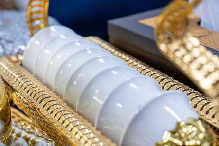 White glossy arabic coffee cups in golden luxury holder