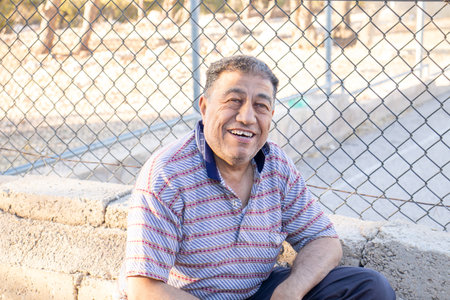 old man smiling during his picnicの写真素材