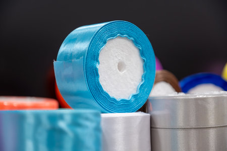 ribbon rolls on store shelf for sale to be used for DIY and gift wrappingの写真素材