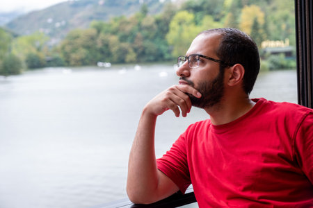 Young arab male feeling relaxed during his vacation , enjoying his timeの写真素材