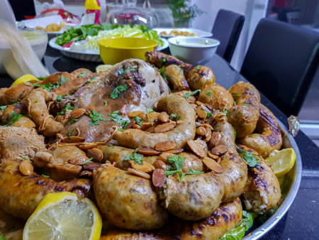 Top view of Tripes with lemon and herbs on black background on table ready to be eatenの写真素材