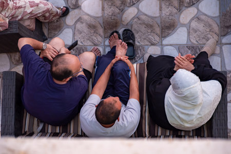 Group of people sitting near each other with smile on their facesの写真素材