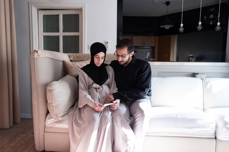 couples feeling excited for their newborn baby and looking wife's tummyの写真素材