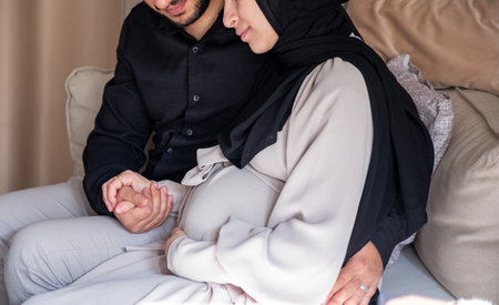 couples feeling excited for their newborn baby and looking at wifes tummy