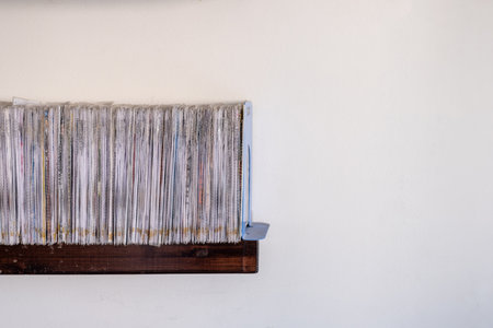 stack of files CD and books on shelf with white background
