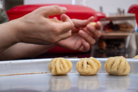 Process of making arabic cookies and kahk for islamic eid after ramadanの写真素材