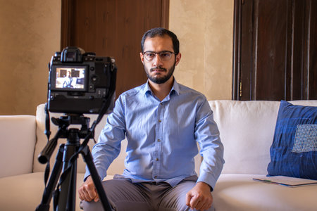 Young arabic man conducting a seminar from home
