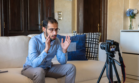 Young arabic businessman streaming from home