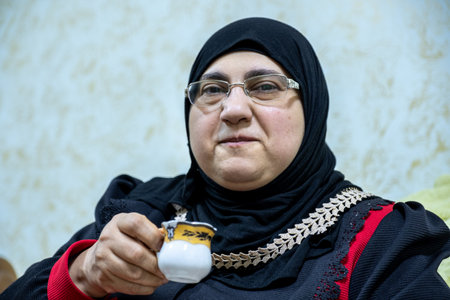 Woman drinking coffee with smiling face