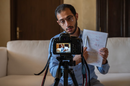 Young arabic businessman streaming from home