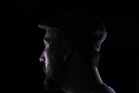 Man wearing glasses on black backgroundの写真素材