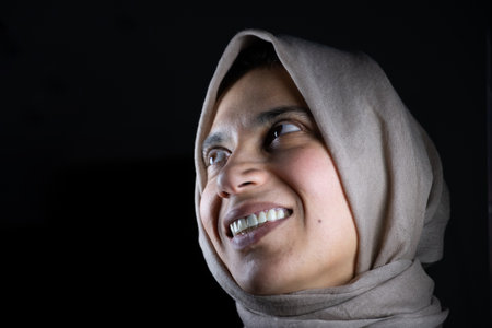 portrait for muslim women on black background in studio with facial expressionsの写真素材