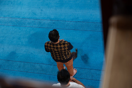 Top view of adult praying in masjid with standing positionの写真素材