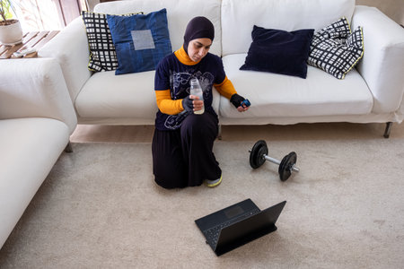muslim woman doing exercises in home