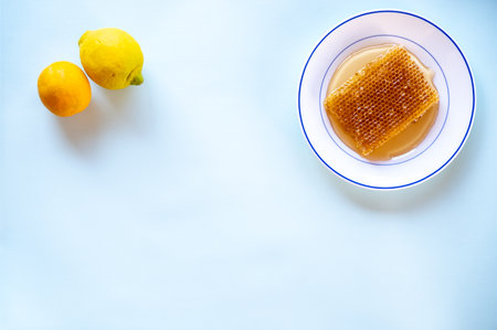 Honey hive with citrus ingredients like lemon and orangeの写真素材