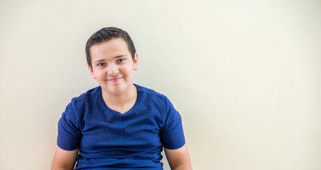 Portrait for a child sitting in the school corridor
