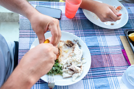 Family gathering to eat fish together