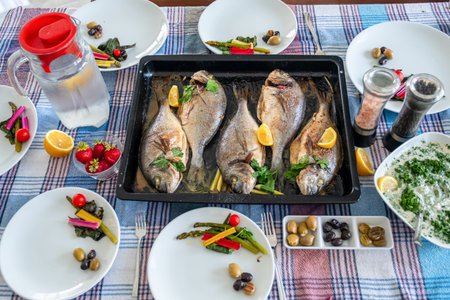 Family gathering to eat fish togetherの写真素材