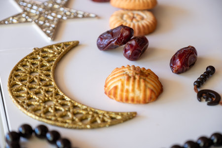 Variety of semolina maamoul cookies displayed with crescent ,star and Ramadan decorations....
