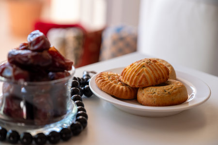 Variety of semolina maamoul cookies displayed with crescent ,star and Ramadan decorations....
