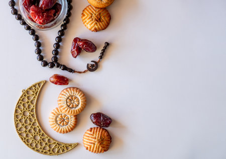Variety of semolina maamoul cookies displayed with crescent ,star and Ramadan decorations....