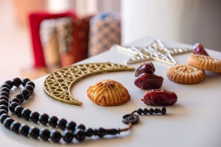 Variety of semolina maamoul cookies displayed with crescent ,star and Ramadan decorations....