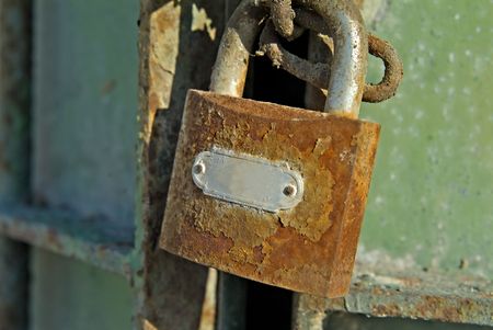 Old Rusty Padlock and Gateの写真素材