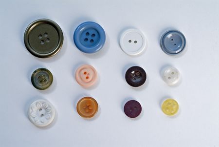 multi color and shape buttons on whiteの写真素材