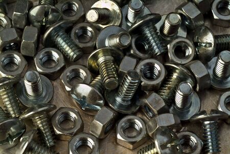 bolt and nut on metallic backgroundの写真素材