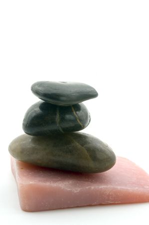 handmade soap and pebbles isolated on whiteの写真素材