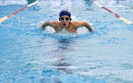 teenager swimmer in a  strokeの写真素材